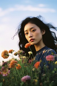 East Asian woman flower portrait outdoors. AI generated Image by rawpixel.