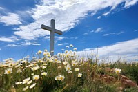 Cross on the flower hill sky outdoors cemetery. 