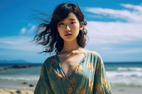 Chinese girl standing near Beach beach adult contemplation. AI generated Image by rawpixel.