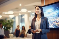 An asian woman presenting company profile on TV screen in the meeting room office adult happy. AI generated Image by rawpixel.