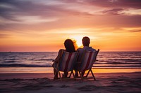 Young couple sitting on the beach chair watching sunset sky vacation outdoors. AI generated Image by rawpixel.