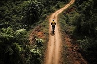 Woman adventure in forest trail outdoors bicycle vehicle. AI generated Image by rawpixel.