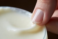 Using shea butter finger milk food. AI generated Image by rawpixel.