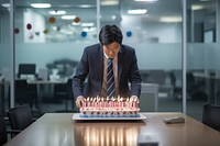 Korean businessman candle cake dessert. AI generated Image by rawpixel.