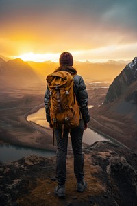 Photo of a person hiking with backpack in mountains at the sunset standing adult mountaineering. AI generated Image by rawpixel.