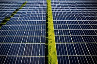 Photovoltaic solar panel farm outdoors solar panels electricity. AI generated Image by rawpixel.