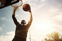 Black man enjoy playing basketball in basketball court sports day competition. AI generated Image by rawpixel.