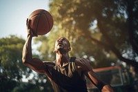 Black man enjoy playing basketball in basketball court sports day determination. AI generated Image by rawpixel.