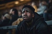 Black man sad at football game in stadium portrait sports adult. AI generated Image by rawpixel.