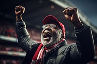 Black mature man cheering football game in stadium shouting sports adult. AI generated Image by rawpixel.