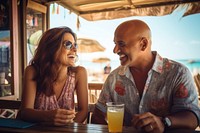 Hispanic bald middle age man and hispanic middle age woman summer adult bar. 