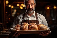 Bakery owner holding tray of bread adult food entrepreneur. AI generated Image by rawpixel.