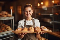 Bakery owner holding tray of bread adult woman food. AI generated Image by rawpixel.