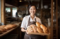 Asian bakery owner holding tray of bread adult food entrepreneur. AI generated Image by rawpixel.