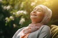 Happy senior hijab woman relaxing outdoors adult sun. AI generated Image by rawpixel.