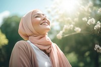 Happy senior hijab woman relaxing outdoors smile adult. AI generated Image by rawpixel.