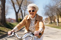 Middle age woman riding bicycle bike cycling outdoors portrait. 