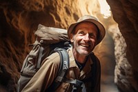 Warm-heart mature man on adventure trail in cave portrait smile adult. AI generated Image by rawpixel.