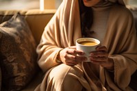 Pakistani woman coffee cup blanket. 