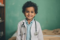 A happy 27 yo doctor from india working in the hospital child stethoscope physician. 