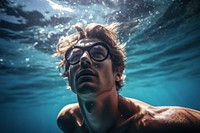 Young man swimming underwater glasses portrait. AI generated Image by rawpixel.