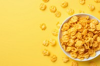 Corn flakes in bowl breakfast freshness abundance. AI generated Image by rawpixel.
