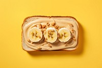 Sandwich with peanut butter and slice of bananas on top food breakfast freshness. 