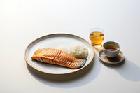 Grilled fish and rice traditional japanese breakfast seafood plate cup. 