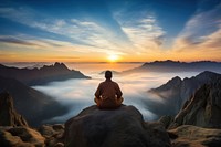 Meditating on rocky mountain top landscape outdoors horizon. AI generated Image by rawpixel.