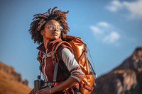 Black young man in safari photography backpack adult. AI generated Image by rawpixel.
