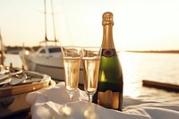 Champagne bottle with glass celebration outdoors drink. AI generated Image by rawpixel.