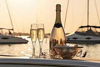 Champagne bottle with glass boat celebration outdoors. AI generated Image by rawpixel.