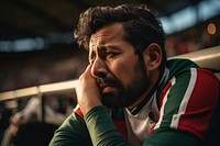 Mexican man sad at football game in stadium worried sports adult. AI generated Image by rawpixel.