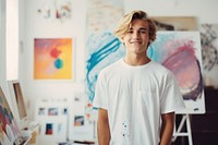 A teenage graphic designer in clean white t shirt studio blonde happy. AI generated Image by rawpixel.
