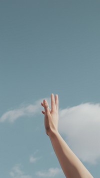 Hand raise up in to the sky finger gesturing outdoors. AI generated Image by rawpixel.