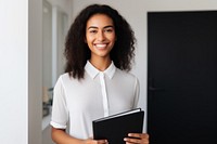 Saleswoman holding a file computer smiling adult. AI generated Image by rawpixel.