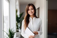Saleswoman holding a file smiling smile architecture. AI generated Image by rawpixel.