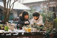 Asian children enjoying outdoors togetherness architecture. AI generated Image by rawpixel.
