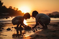 Thai children playing beach outdoors sunset. 