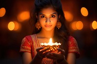 Diwali candle festival holding. AI generated Image by rawpixel.