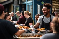 Volunteers serving food restaurant adult togetherness. 