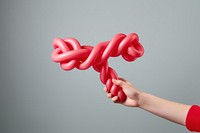 Balloon twisting knot gray background anniversary. AI generated Image by rawpixel.