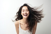 Asian woman carefree laughing smile. AI generated Image by rawpixel.
