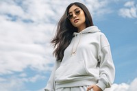 A Thai young woman standing by a car sweatshirt sky accessories. AI generated Image by rawpixel.