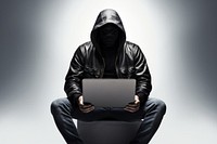 Anonymous young man hacker in hood sitting playing laptop sweatshirt computer portrait. AI generated Image by rawpixel.