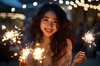Cheerful japanese woman sparkler sparks smile. AI generated Image by rawpixel.