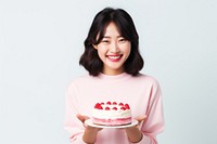 Japanese girl cake dessert holding. AI generated Image by rawpixel.