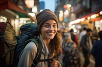 A Latina Brazilian female backpacker having fun exploring the night markets in Hong Kong portrait travel adult. AI generated Image by rawpixel.