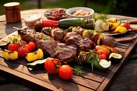 Assorted delicious grilled meats and vegetables on barbecue on rustic wooden planks grilling cooking food. AI generated Image by rawpixel.