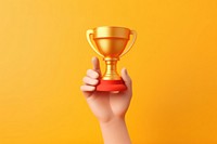 Golden trophy holding hand achievement. AI generated Image by rawpixel.